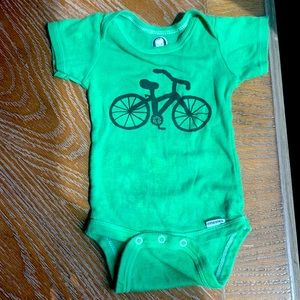 Hand dyed and printed baby bicycle onesie.